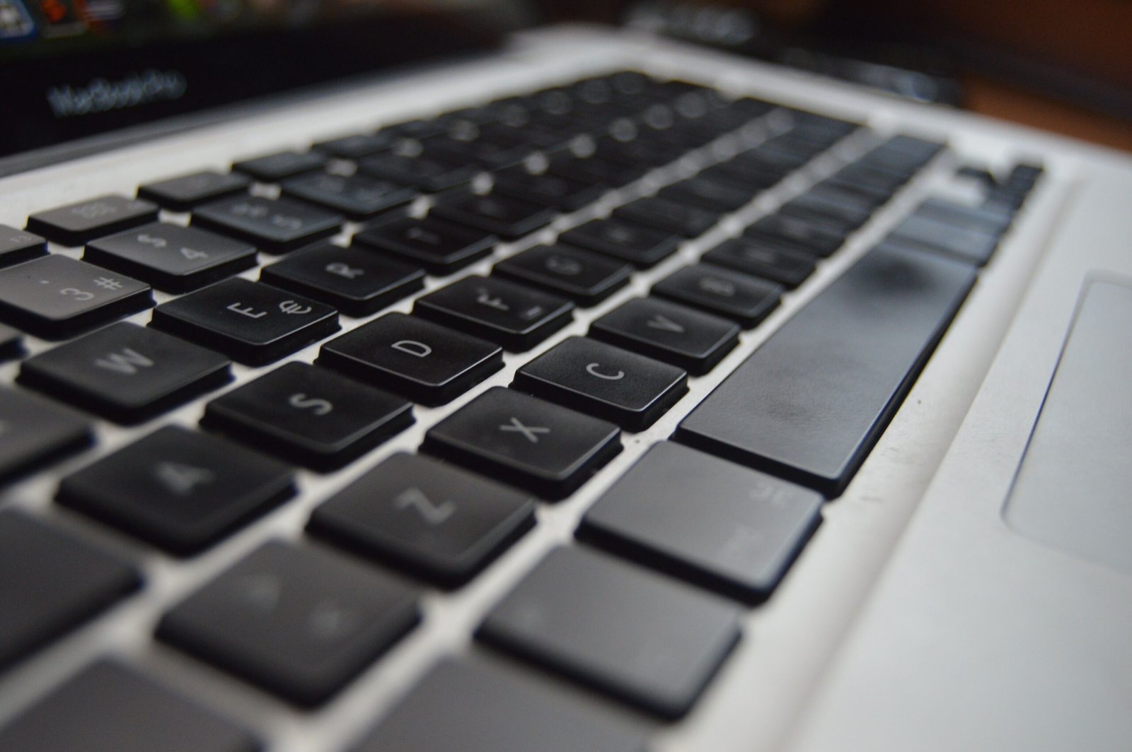 Detailed close-up of a laptop keyboard showcasing technology and productivity aspects.